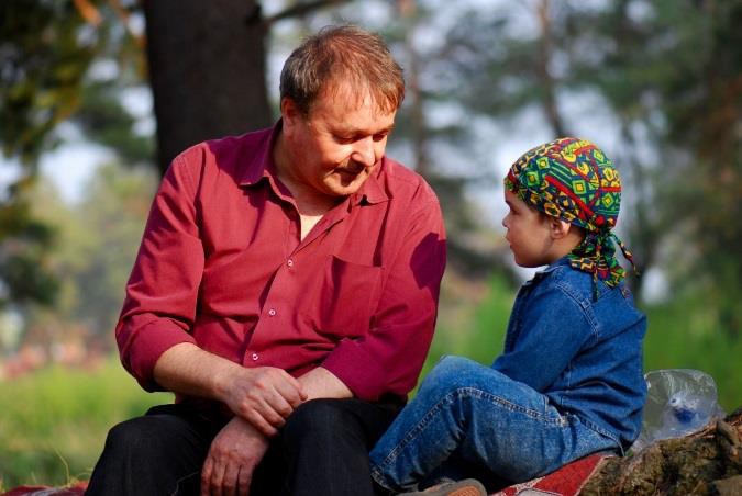 A father speaking to his child.