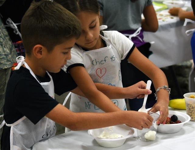 Two children cooking together.