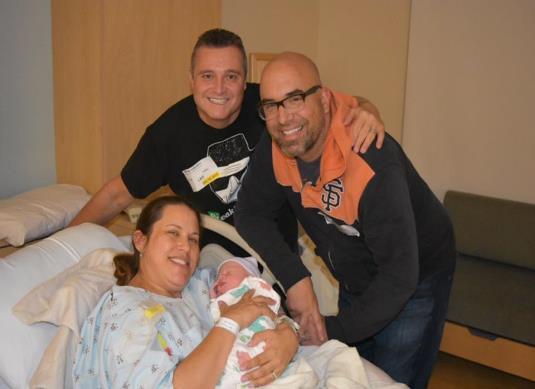 A same-sex couple with a surrogate.