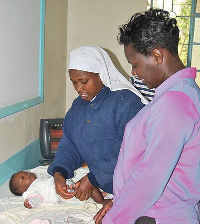 A nurse giving an infant vaccinations.