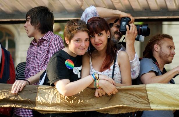 This teen couple is at a LGBTQIA pride event.