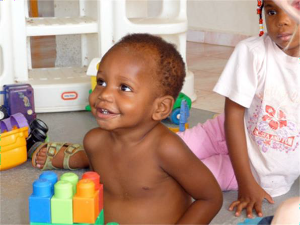 Two children playing with toys.