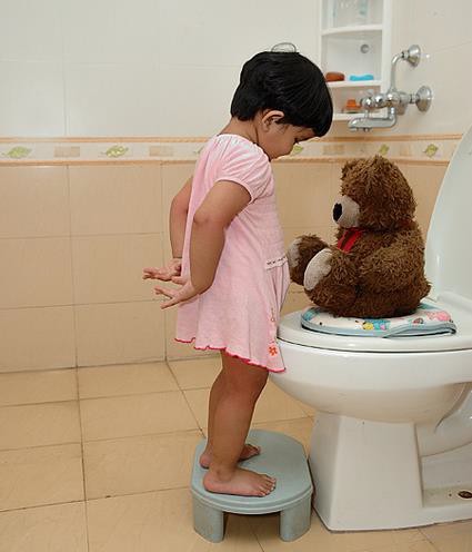 A child learning to be toilet trained.